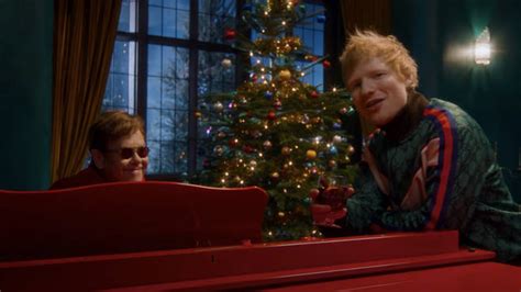 What songs do Ed Sheeran and Elton John parody in the 'Merry 